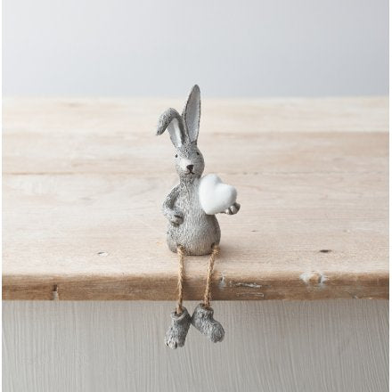 Sitting rabbit with dangly legs and heart